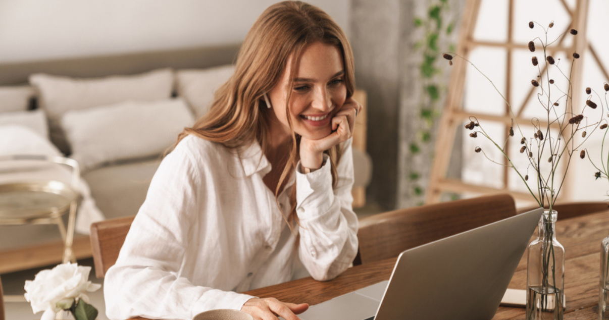 Happy woman using the payment stack offered by Billforward