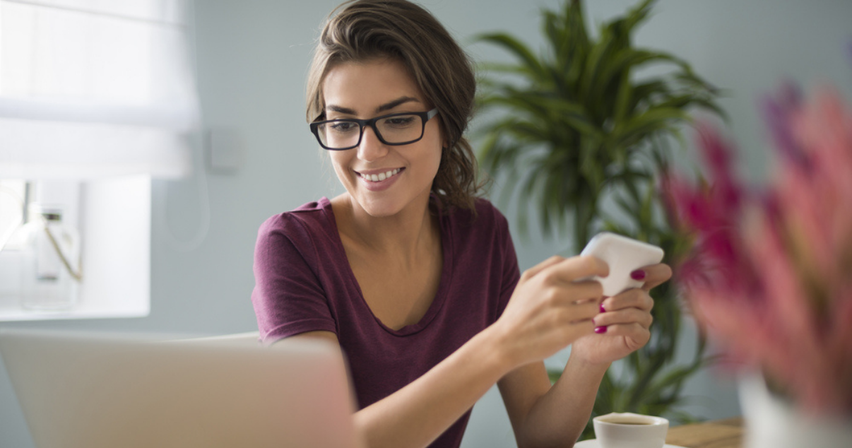 Happy business woman learning about what is a payment stack