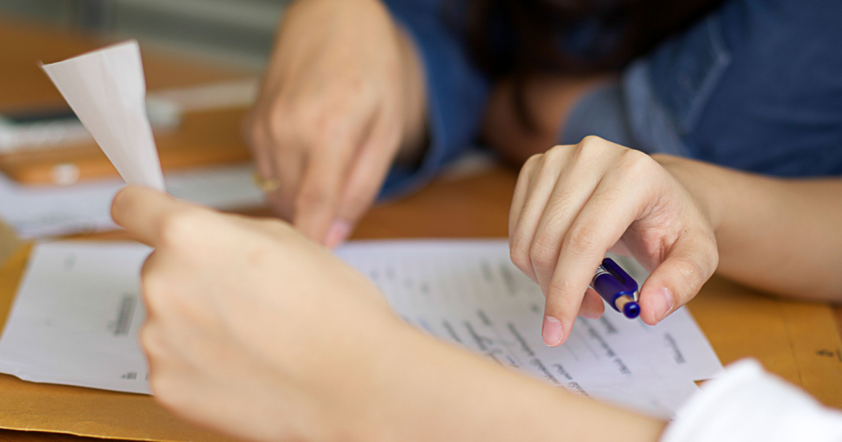 Business team filling forms and paying taxes efficiently